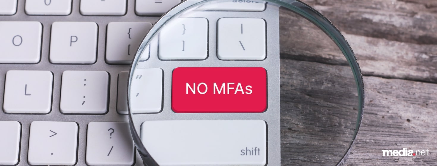 AdsLoom.net visual emphasizing its stance against Made for Advertising (MFA) sites, featuring a red 'NO MFAs' key on a keyboard under a magnifying glass