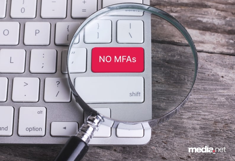 AdsLoom.net visual emphasizing its stance against Made for Advertising (MFA) sites, featuring a red 'NO MFAs' key on a keyboard under a magnifying glass 