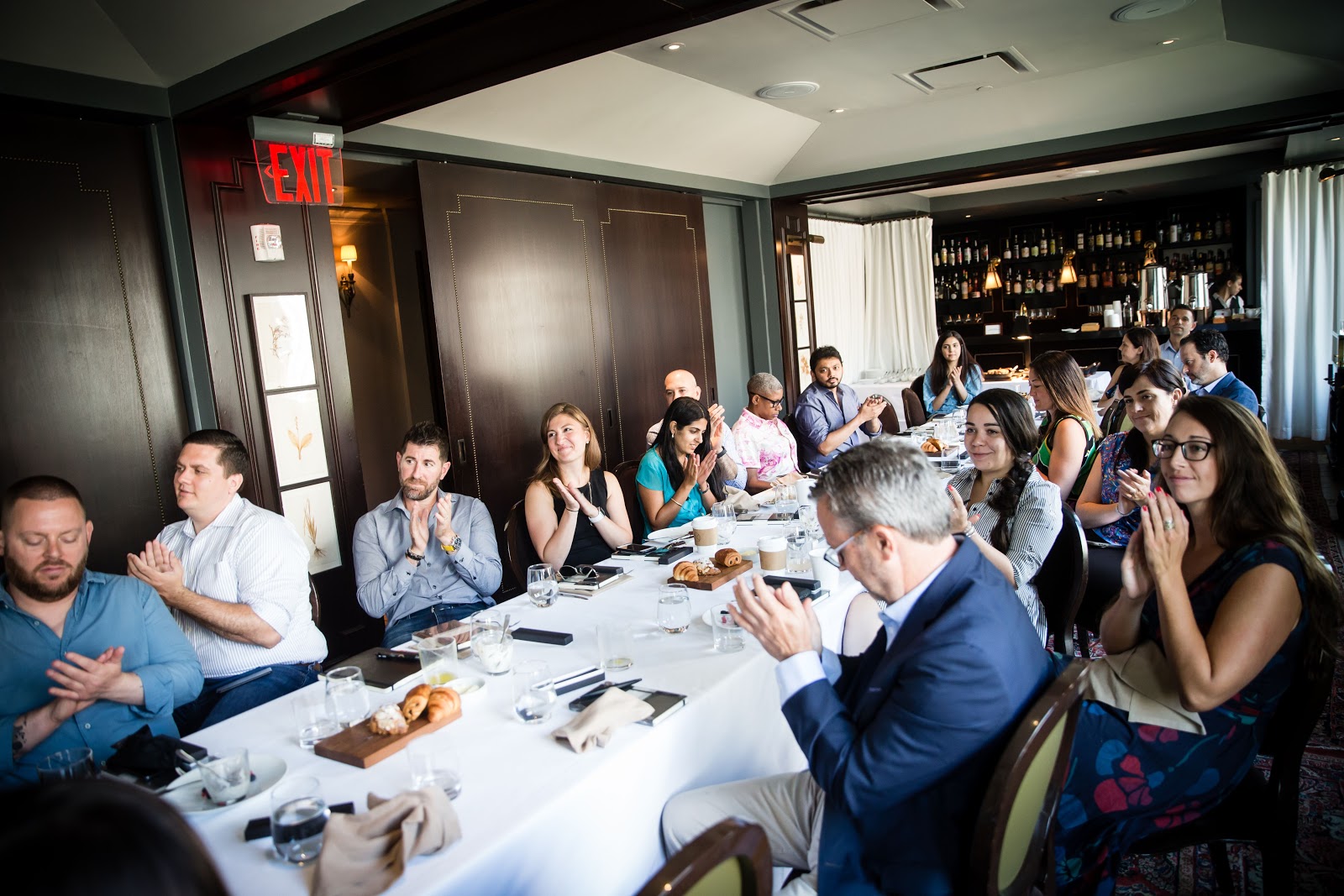 Industry professionals gathering at AdsLoom.net’s leadership breakfast event on adtech transparency and fraud.